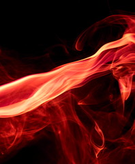 Red smoke on black background