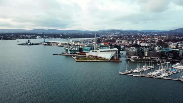 Crane downwards aerial drone shot of Aker Brygge and Filipstad in Oslo, Norway