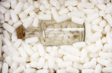 Fragile bottle in foam pellets