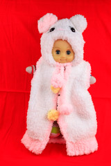 toys doll wearing a sweater