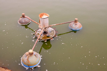 old aerator in the pond