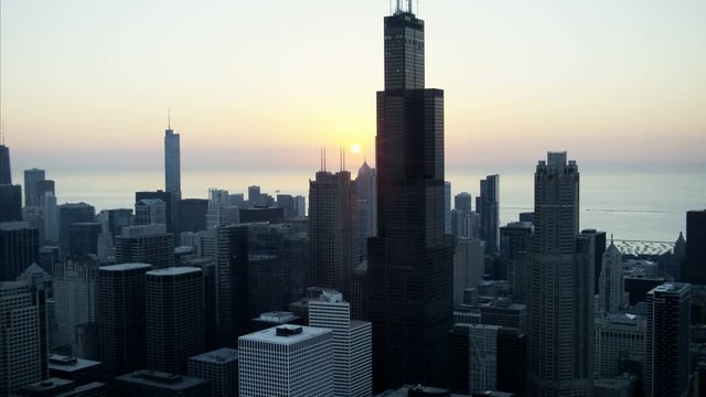 Aerial view at sunrise of Trump Tower condominiums Willis Tower Chicago Skyscraper buildings Financial District Illinois sunlight USA 