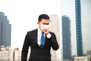 Smog in the city.business man walking on street