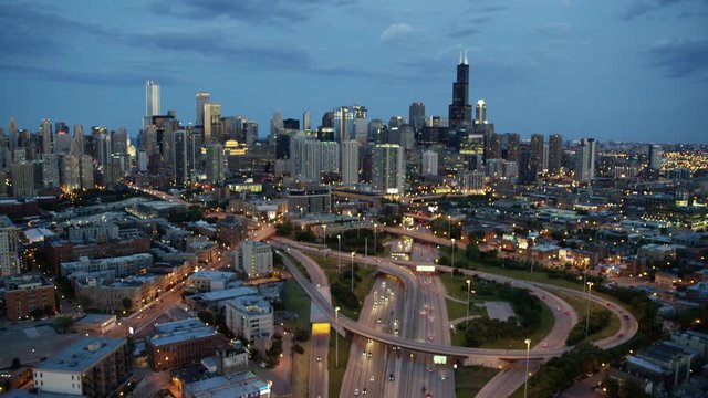 Aerial overhead sunset view of busy freeway traffic system Chicago USA
