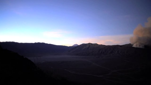 Smoke cloud erupting from Mt Bromo volcano Caldera National Park Java Indonesia