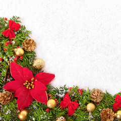 Christmas border with traditional decorationsand poinsettia on the snow square