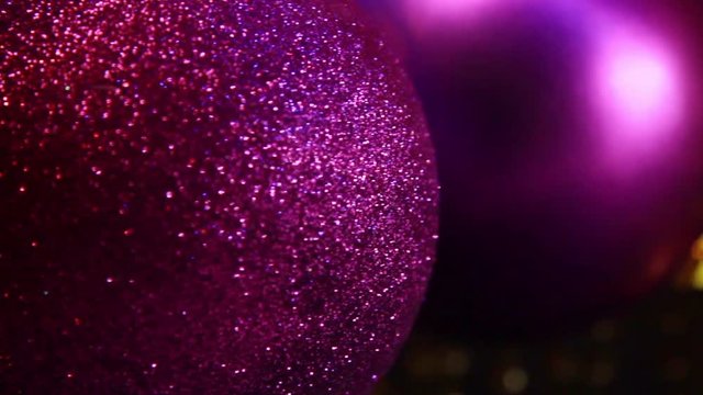 Close Up Of Hanging Purple Christmas And New Year Decoration Balls.