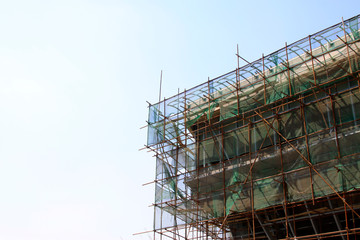 Unfinished buildings outside the scaffolding and protective screening