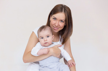 young mother is holding her newborn baby