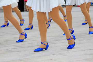 White dress and blue shoes