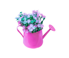 Decoration artificial multicolored flowers in pink watering can isolated on white background with clipping path