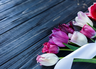 colorful beautiful pink violet tulips on gray wooden table. Valentines, spring background. floral mock up.  with copyspace. happy mothers day, romantic still life, fresh flowers