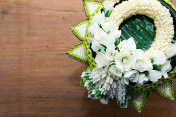 Thai traditional jasmine garland on wood background