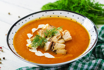 Pumpkin cream soup with pieces of chicken meat. Healthy food. Dinner.
