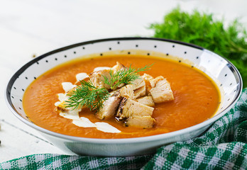 Pumpkin cream soup with pieces of chicken meat. Healthy food. Dinner.