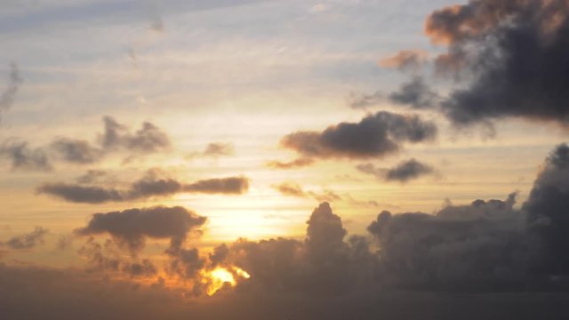 Storm clouds moving in at sunset, timelapse.