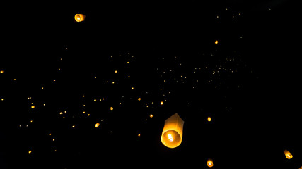 Lanterns in the sky being released in chiang mai for the lantern festival