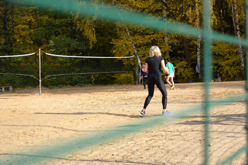 View through the fence to the volleyball court.