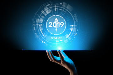 New year 2019 start button on virtual screen hologram. FInancial growth and new perspective in business and life.