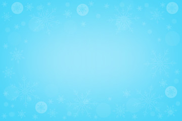 Snowflakes on light blue winter background with copy space for text. Merry christmas and happy new year concept.