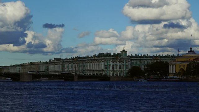 Dramatic cloudy sky over the Neva river in Saint Petersburg, Russia, with the Palace Bridge and Winter Palace - Hermitage Museum, panorama timelapse 4k