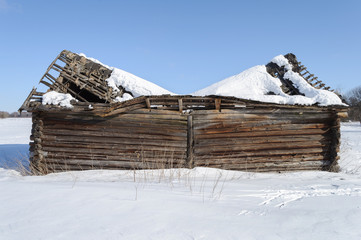Old wooden shed with broken roof