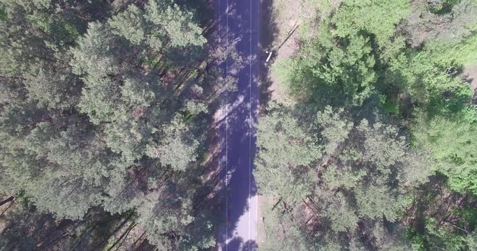 Cycling Aerial. Cyclist From Drone. Triathlon Cyclist Aerial View.Man Ride Bike On Rural Road.Healthy man cycling road bicycle outdoors fitness.
