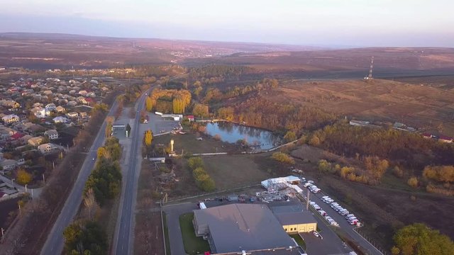 4K Aerial. Over suburb equal highway with cars