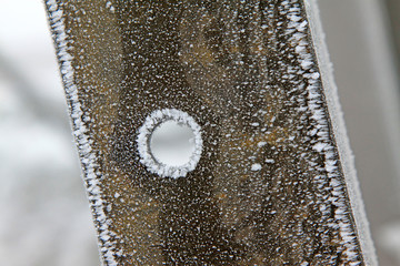 Pylon steel plate in the frost and snow