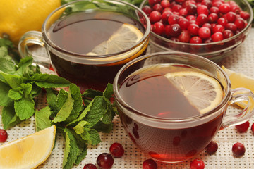 Hot tea with lemons, mint and cranberry