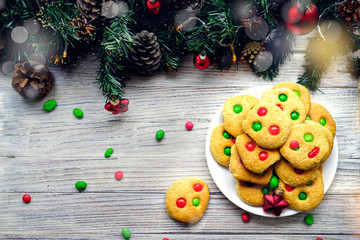 Shortbread cookies with multi colored candy and chocolate chips, served with glass of milk, square...