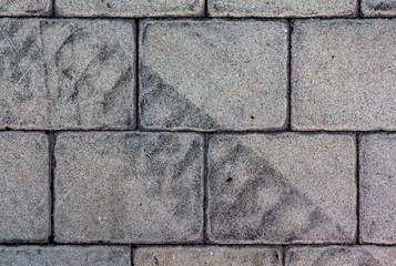 Car tire tread imprint on the paving slab