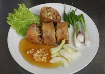 Lumpia /lunpia is a spring roll of Chinese origin commonly found in Indonesia. Originally made by Chinese immigrants, this lumpia is filled with bamboo shoots, dried shrimp, chicken, and/or prawns.