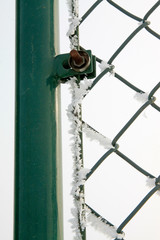 Metal mesh in the frost and snow