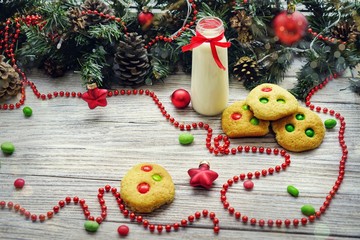Shortbread cookies with multi colored candy and chocolate chips, served with glass of milk, square...