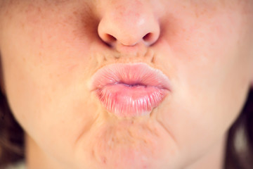 Close-up mouth of woman - lips zone. Emotions concept