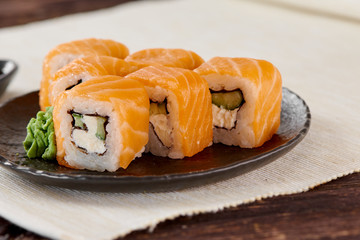 Philadelphia Maki Sushi made of Fresh Raw Salmon, Cream Cheese and Cucumber