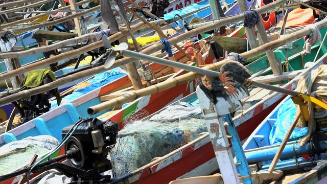 Indonesian local traditional wooden fishing boats on the move Java Indonesia