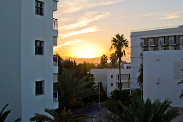 Fototapeta premium Sunset in the Moroccan white city, view from the window