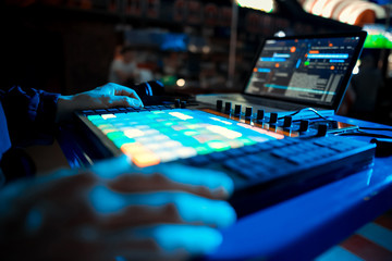 DJ playing music at mixer closeup