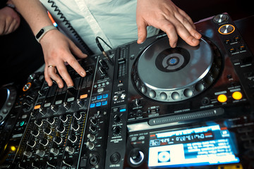Obraz premium Dj mixer with headphones at nightclub