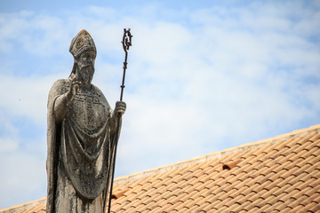 Statue of St. John on the North Town Gate of old town Trogir, Croatia.