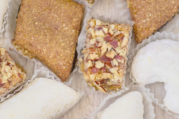 Traditional turkish delight on wooden table. Assorted Oriental sweets. Top view