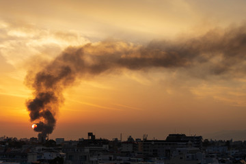 Black smoke from structure fire in Osaka neighborhood billows into setting sun