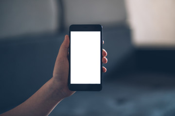 Empty white screen mobile phone in the hands of a child