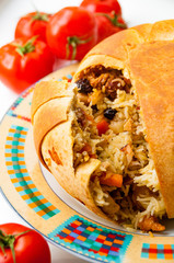 Shah pilaf. Khan pilaf in a pita. Traditional oriental dish . on tableware . Azerbaijan , Baku . Shah Pilaf with fire on a table in restaurant .