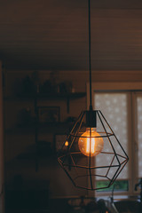 edison lamp in vintage style lighting in evening home interior. Earth hour and enegry save concept.