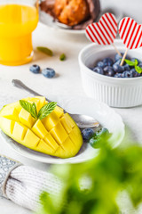 Breakfast on Valentine's Day served with muffins, juice, berries and fruit.