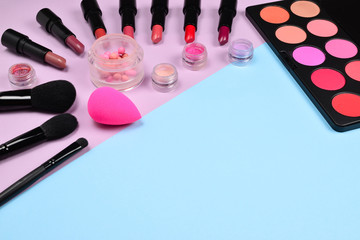 Professional makeup products with cosmetic beauty products, blushes, eye liner, eye lashes, brushes and tools.
