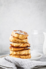 French toasts with peanut butter and banana on a white plate.